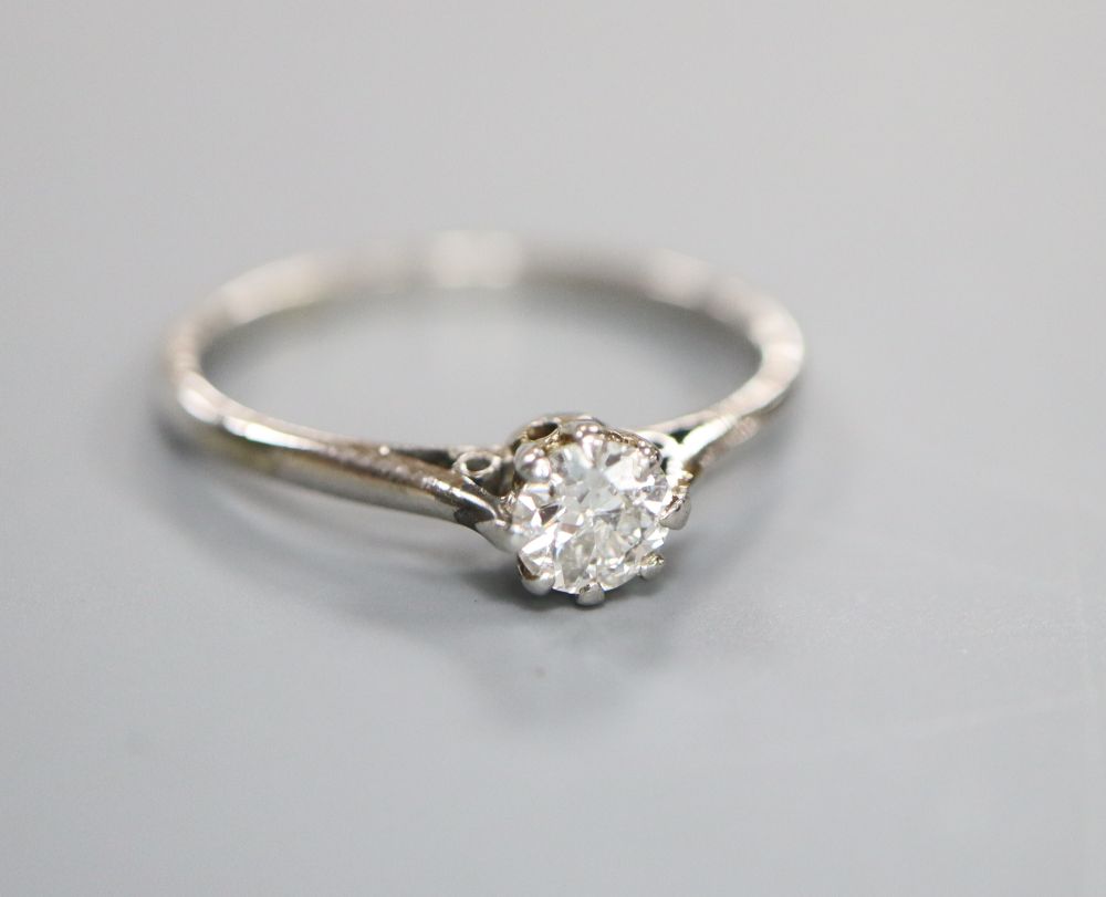 A white metal and solitaire diamond ring, size J/K, gross 2 grams,